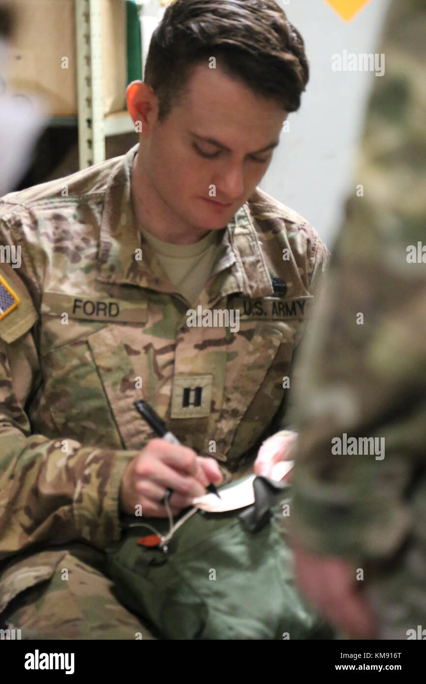 Cpt. Thomas Ford lables chemical masks during the 352nd Civil Affairs Command's mask fitting and inspection during November's Battle Assembly. Stock Photo