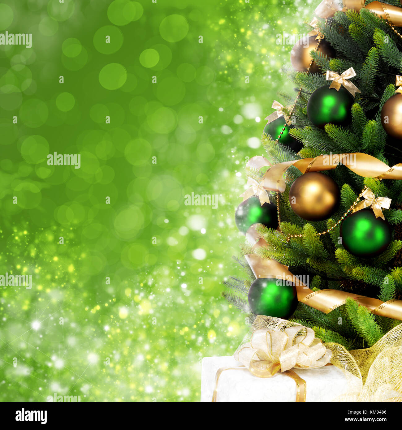 Magically decorated Christmas Tree with balls, ribbons and golden ...