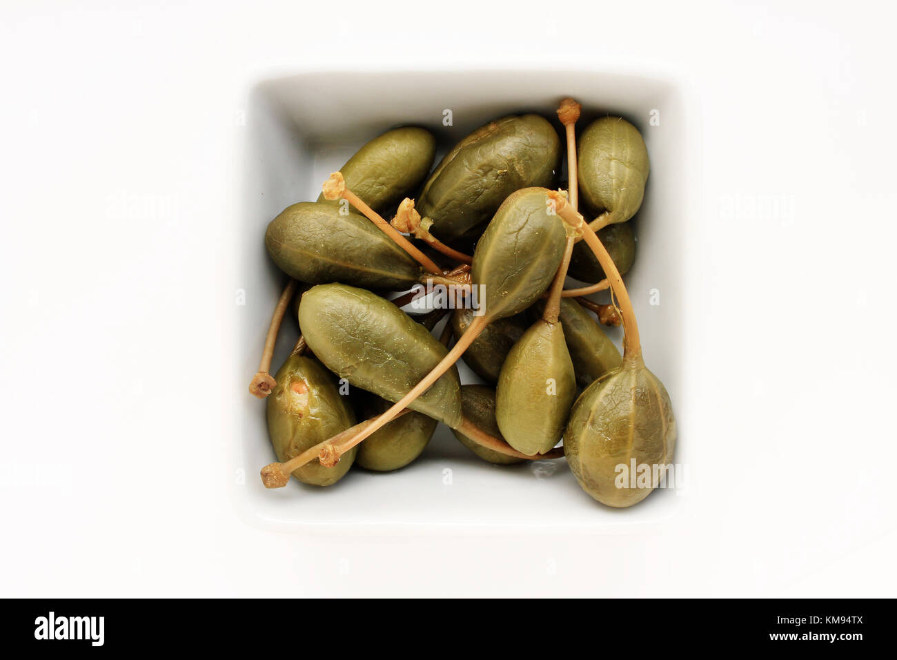 caper berries isolated on white Stock Photo Alamy