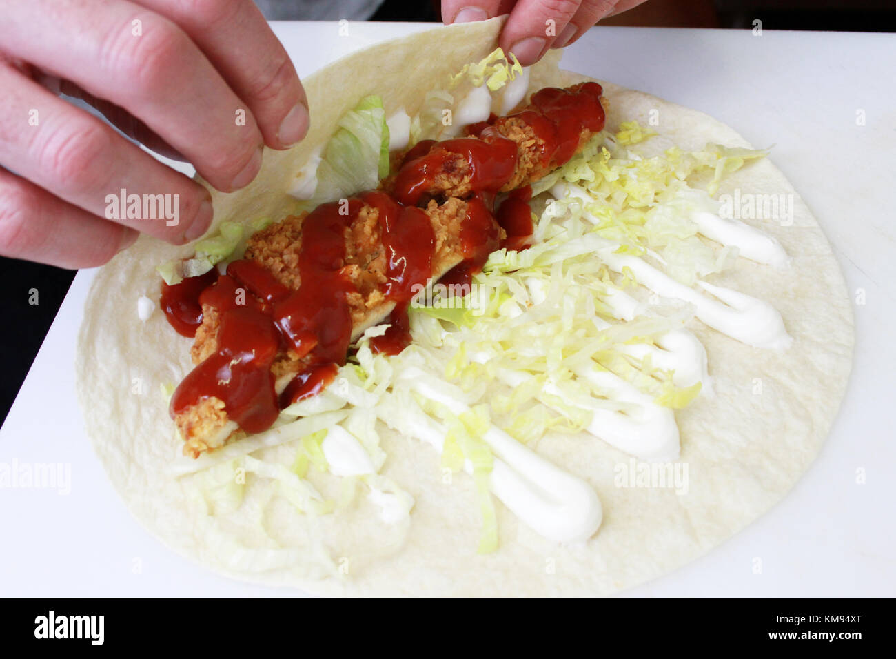 chef preparing chicken wrap Stock Photo - Alamy