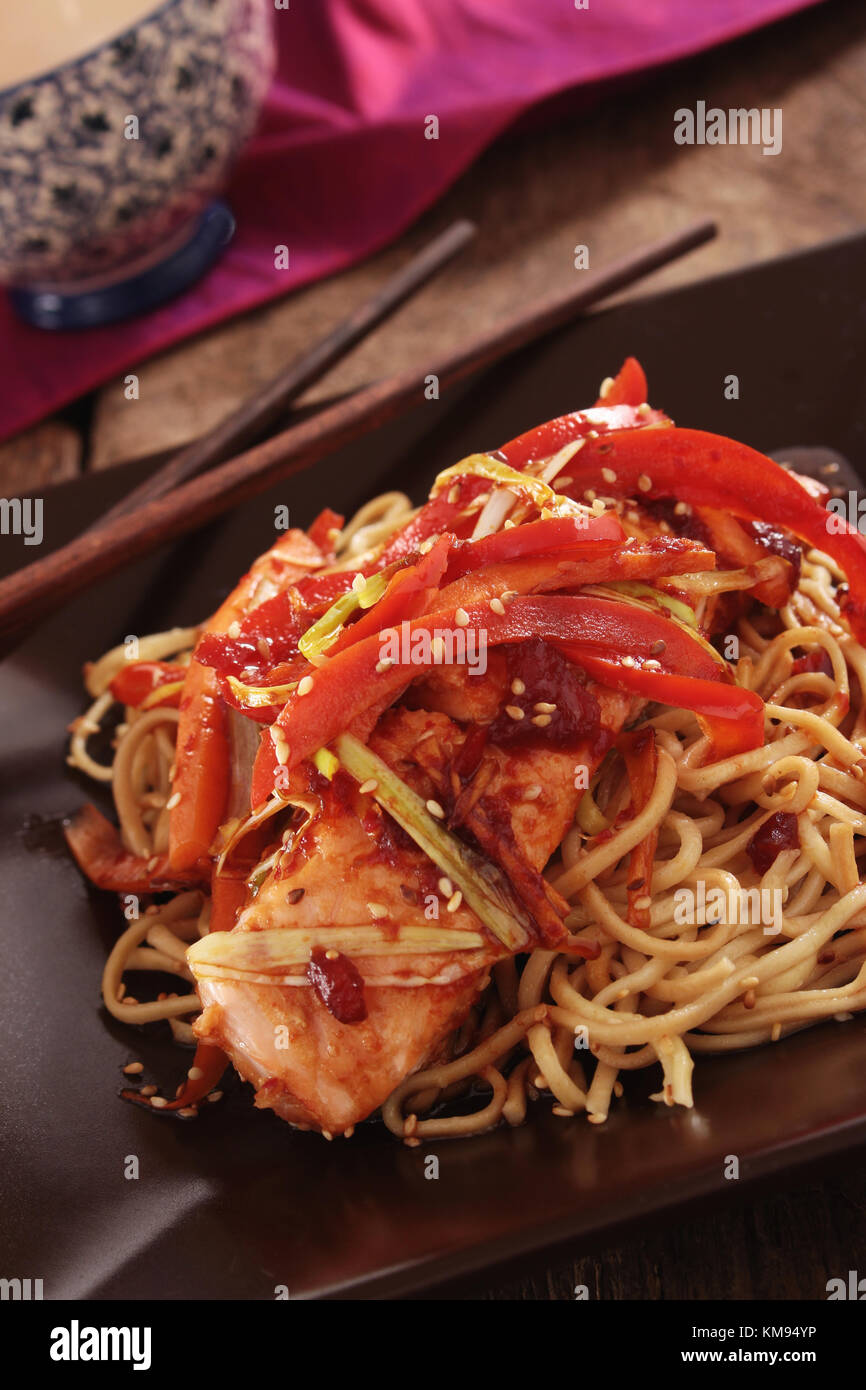 chinese style salmon fillet with noodles Stock Photo - Alamy