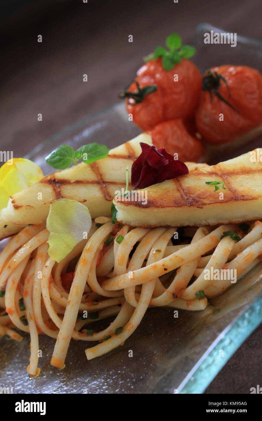 grilled houlumi with spaghetti plated meal Stock Photo