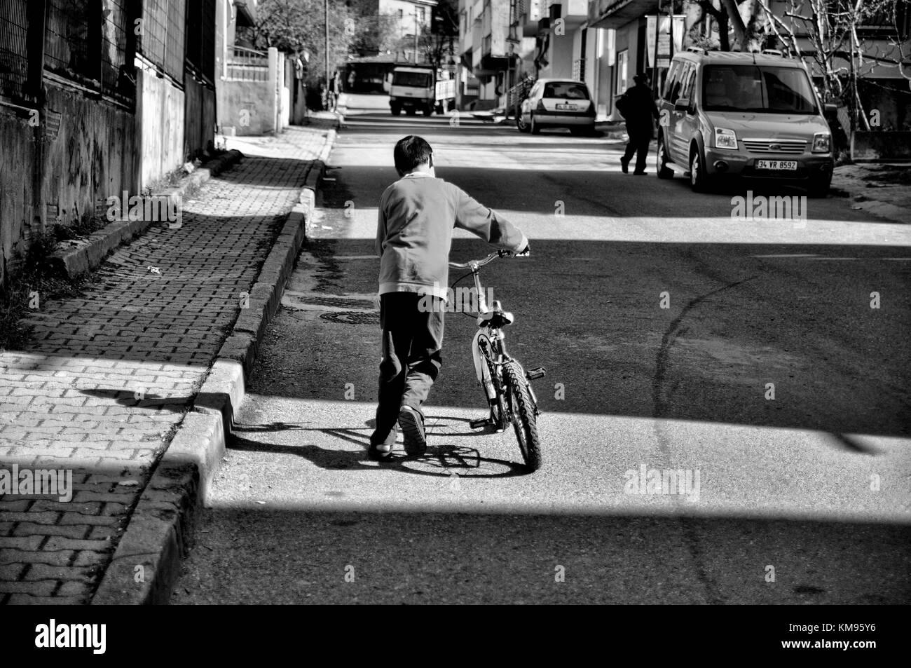 child, street, bike, hope, justice Stock Photo