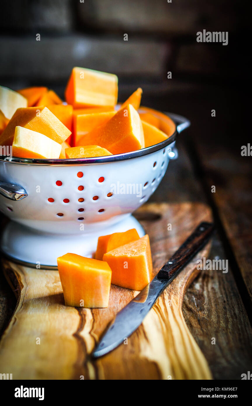 Fresh Cut Pumpkin On Rustic Wooden Background Stock Photo - Alamy