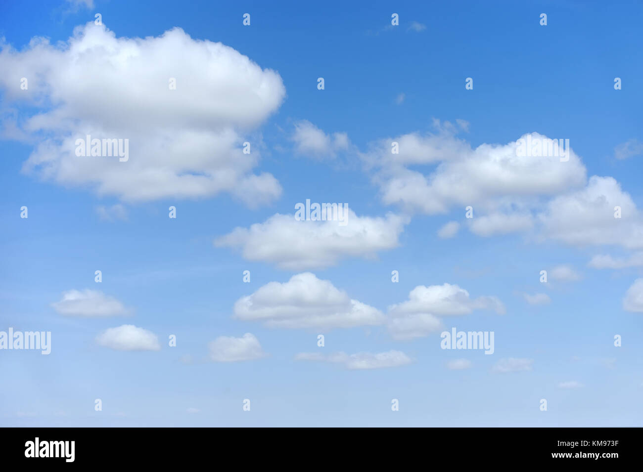 Blue sky background with many white clouds Stock Photo - Alamy