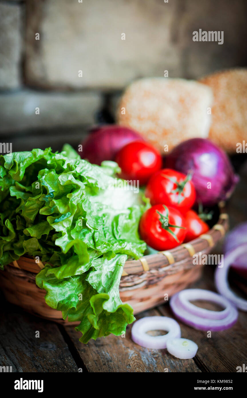 Fresh Vegetables In The Basket On Wooden Background Stock Photo - Alamy