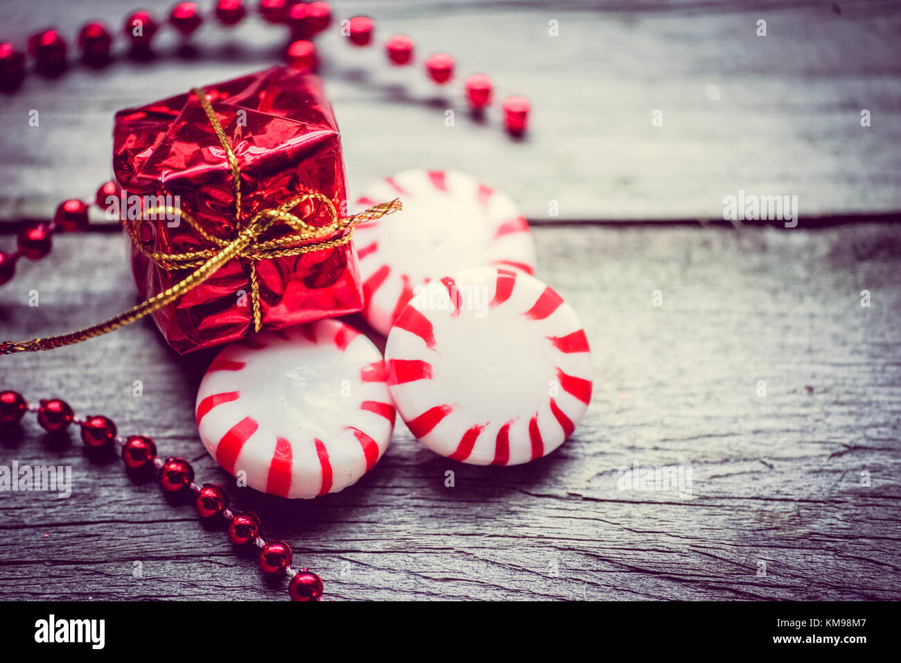 Peppermint candies on wooden background Stock Photo - Alamy