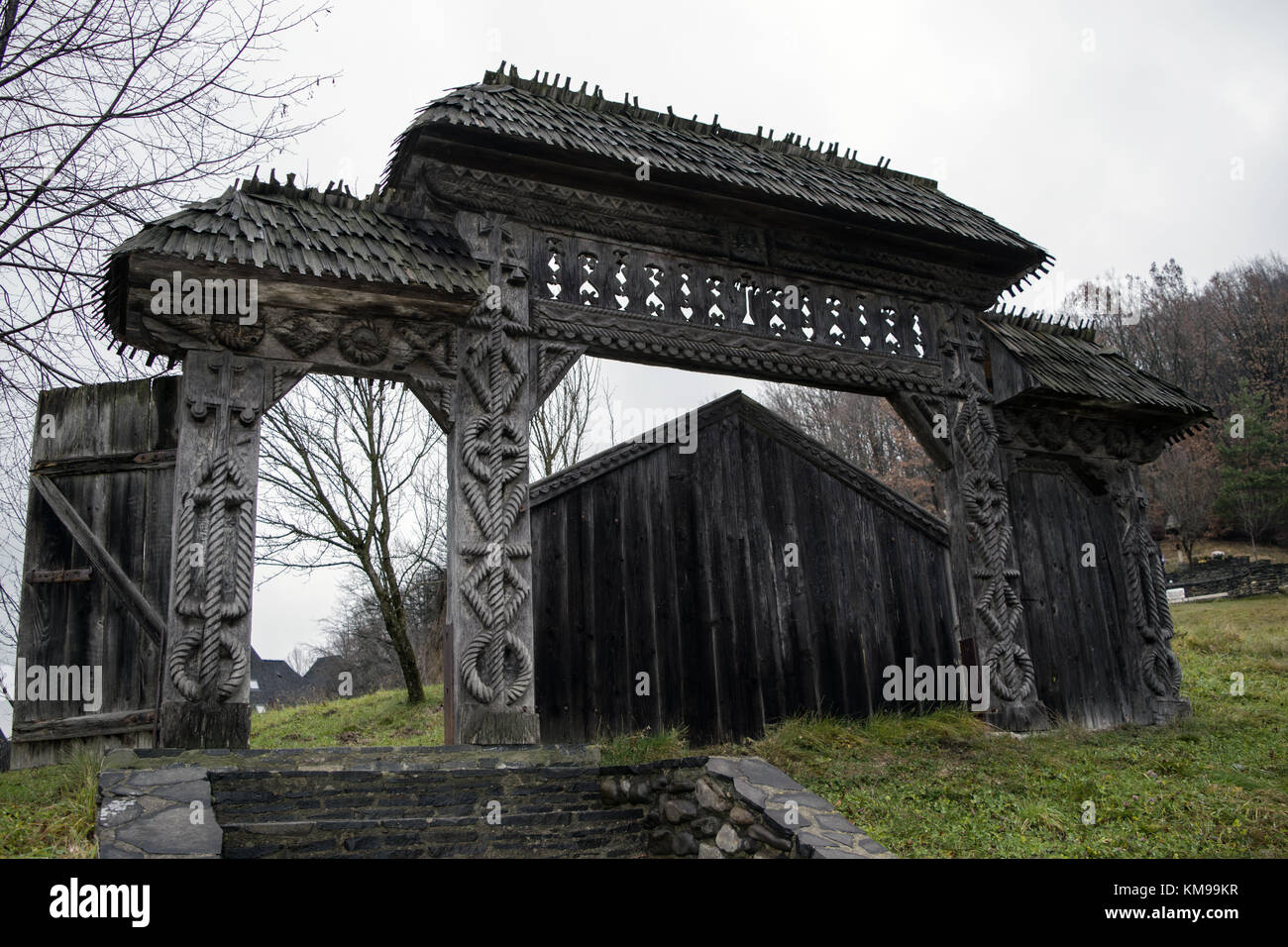 Wooden gate with sculptured patterns, a tradition of Maramures Stock ...