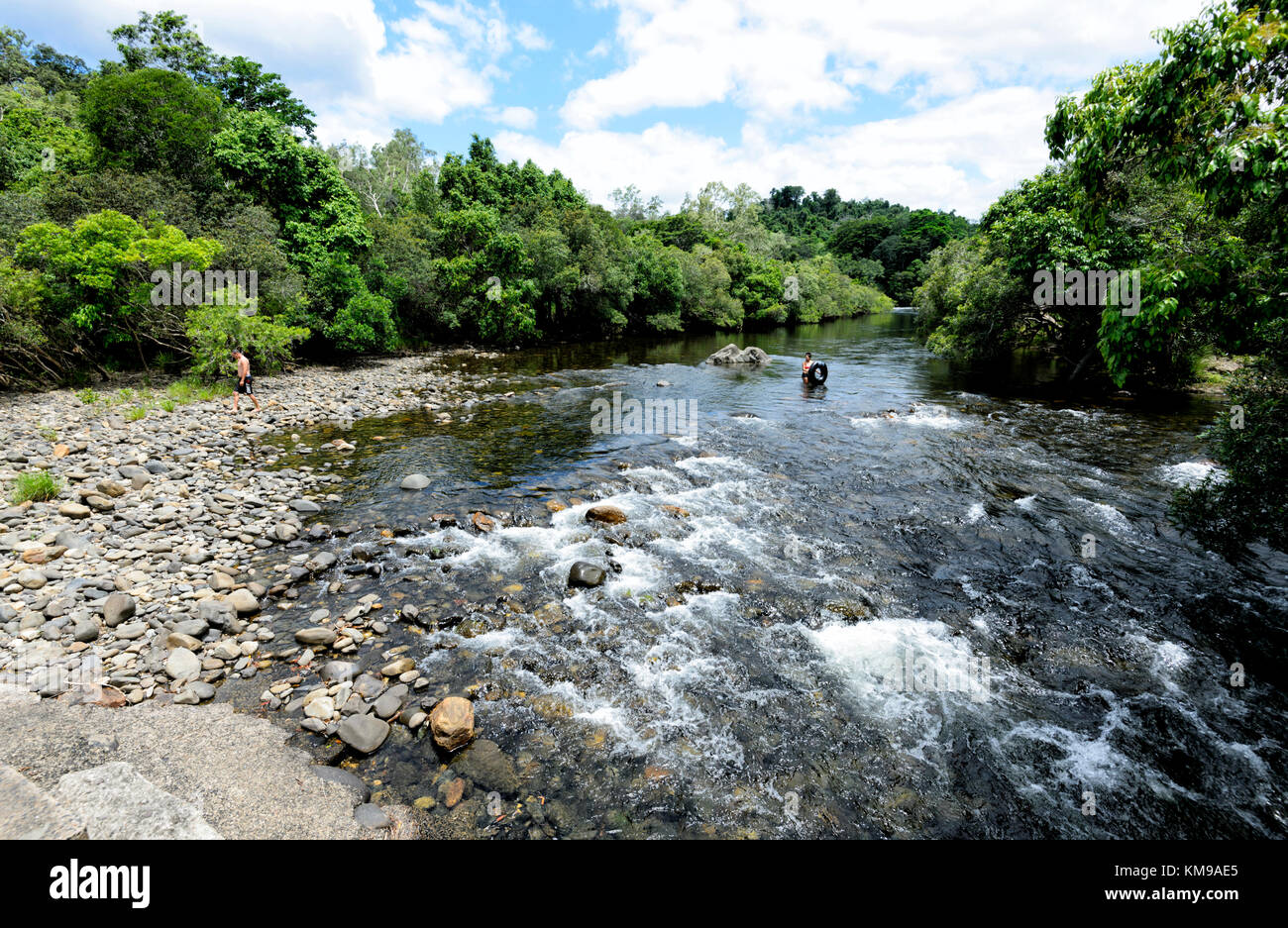 People swimming in the Mulgrave River which runs through the scenic