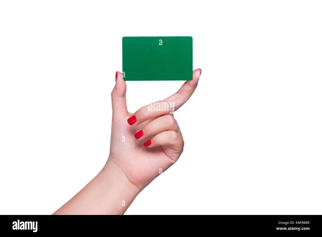 Woman's hand holding blank green card isolated on white. Stock Photo