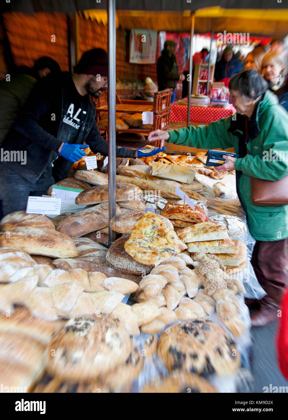 A busy artisan bakers stall with unusual sour dough breads at the award winning  Farmers Market in Stroud,Gloucestershire, UK Stock Photo
