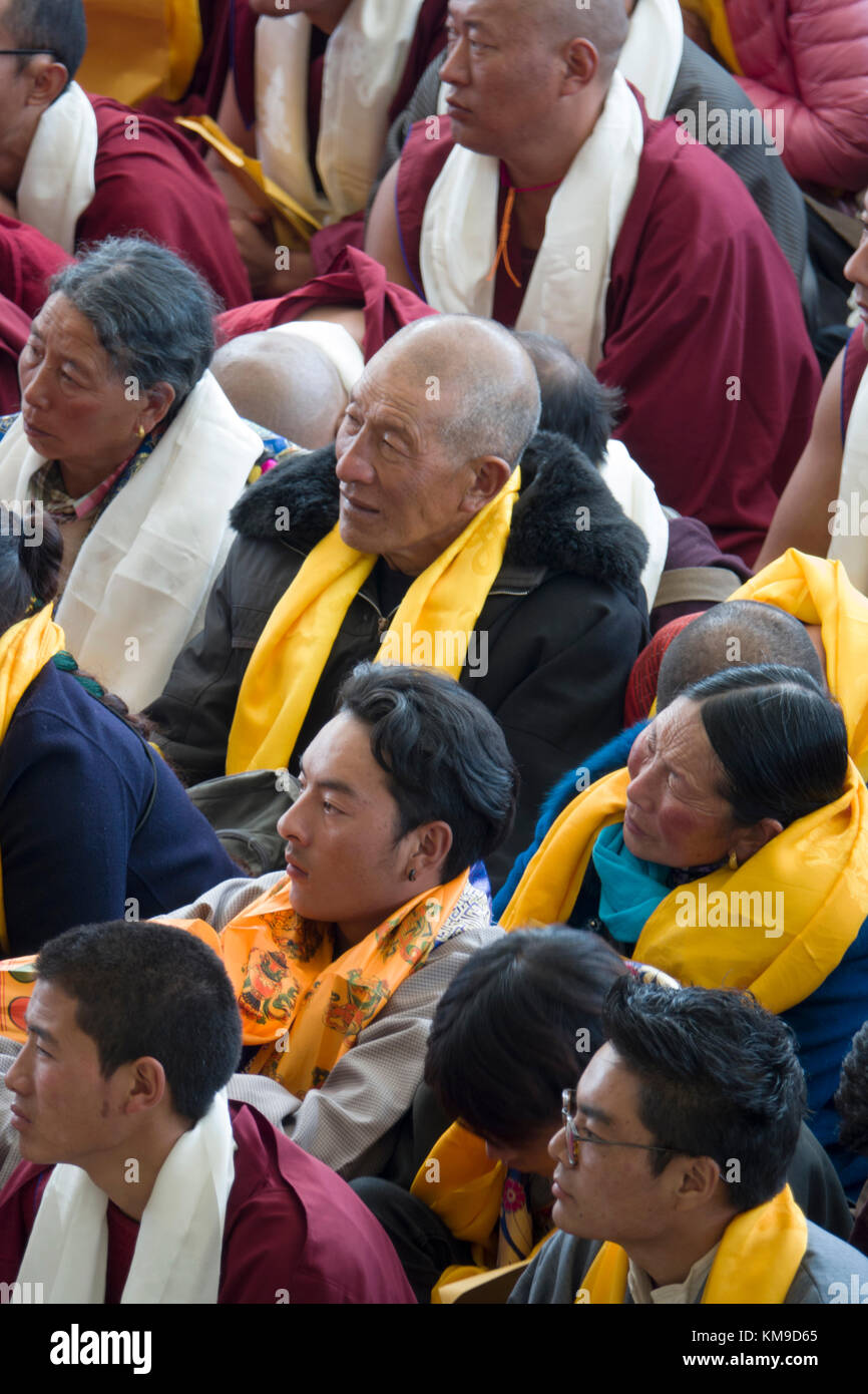 Buddhist disciples listening to His Holiness the 14th Dalai Lama at Namgyal Monastery in McLeod Ganj, India Stock Photo