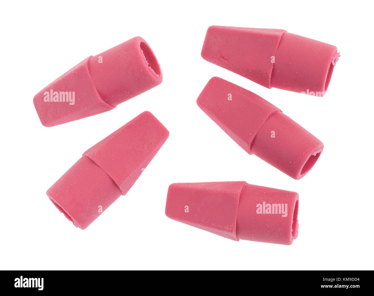 Five synthetic rubber pencil erasers isolated on a white background