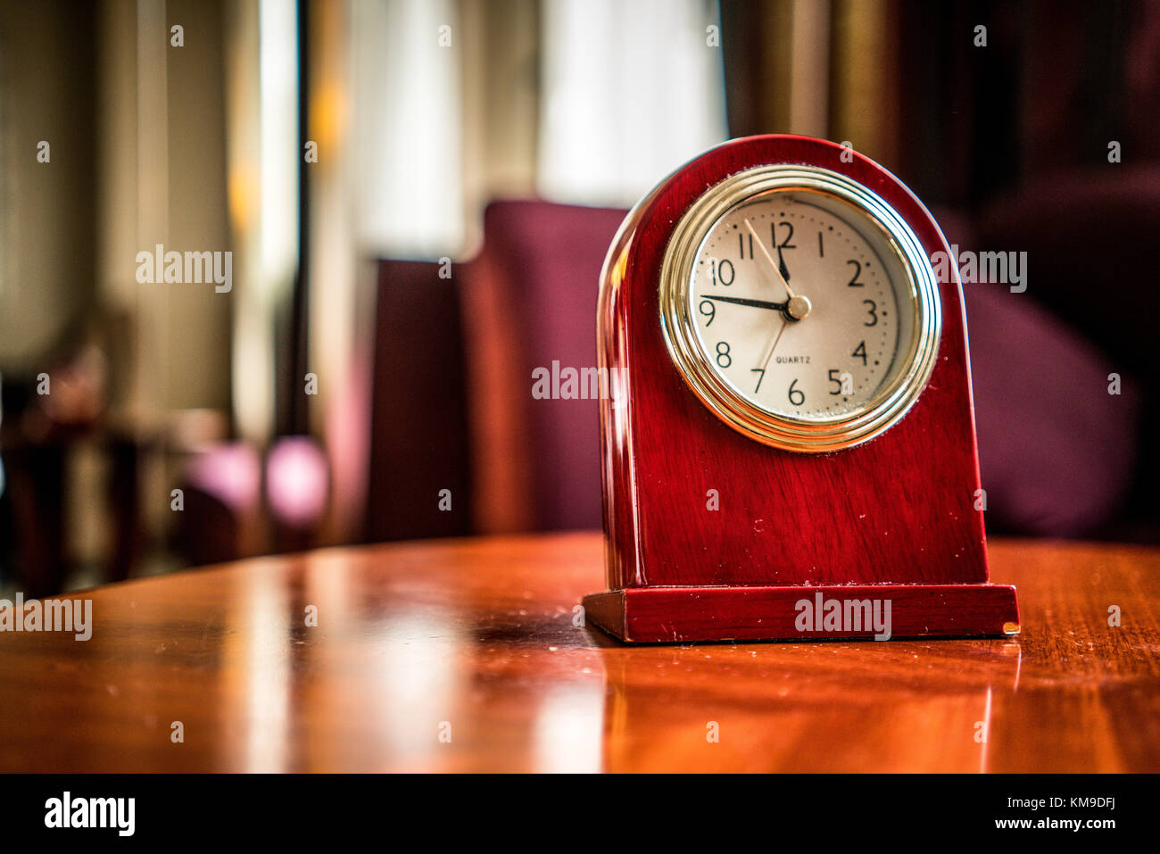 Old Fashioned wooden clock in boudoir vintage style ambiance - time pass concept Stock Photo