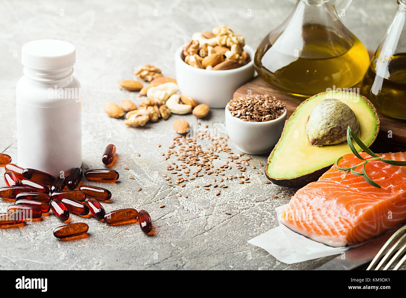 healthy-fats-in-nutrition-salmon-avocado-oil-nuts-concept-of-healthy-KM9DK1.jpg