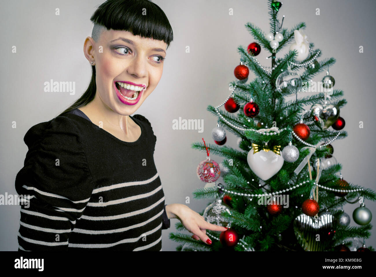 Person standing next to tree hi-res stock photography and images - Alamy