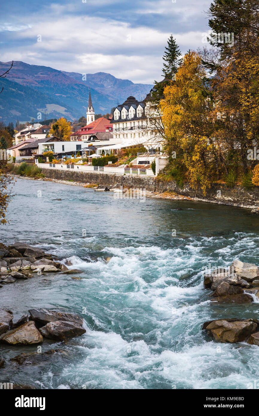 The Drava River with fall foliage color in Lienz, East Tyrol, Austria