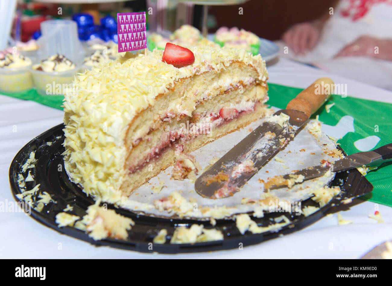 Half eaten birthday cake Stock Photo