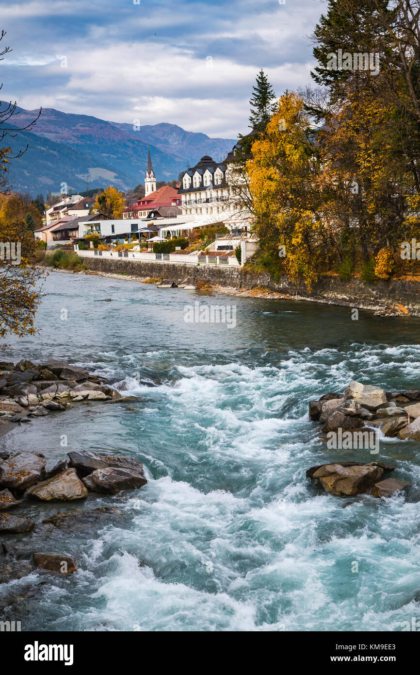 The Drava River with fall foliage color in Lienz, East Tyrol, Austria