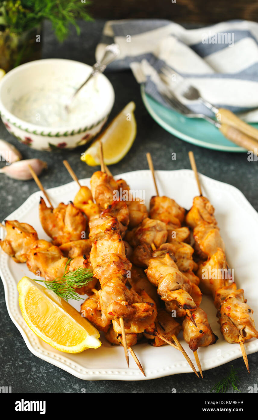 Marinated Chicken skewers with lemon and yogurt dressing Stock Photo