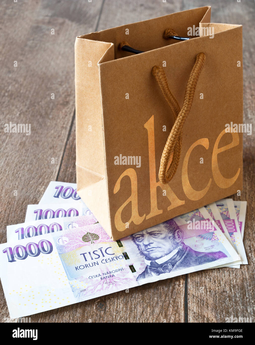 Czech economy and finance - paper shopping bag and czech banknotes - české  peníze a nákupní taška - slevy a akce Stock Photo - Alamy
