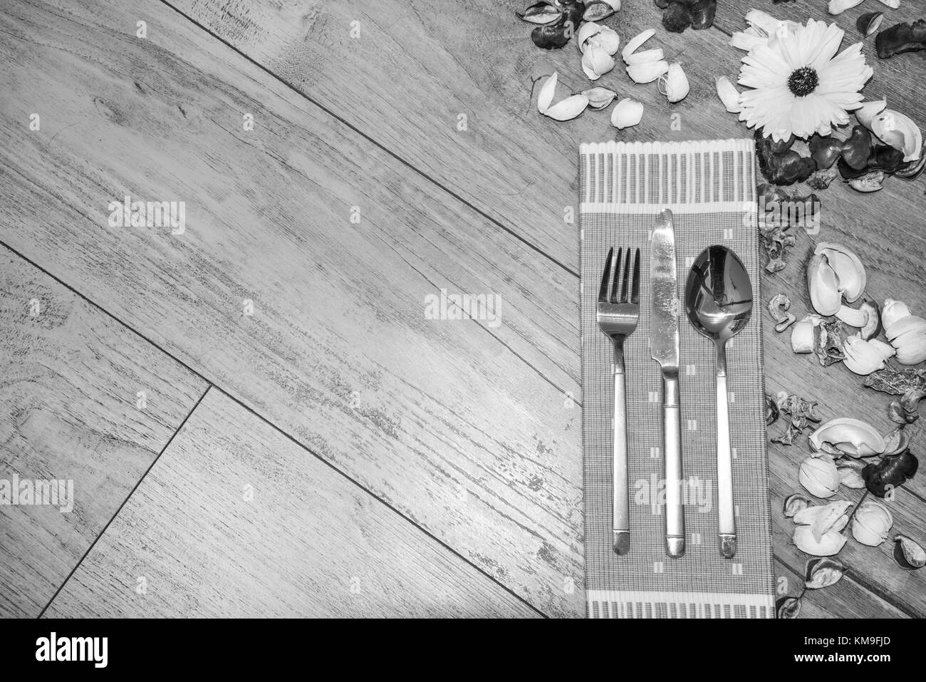 Elegant Wooden Table Setting - Cutlery On Green Napkin Stock Photo