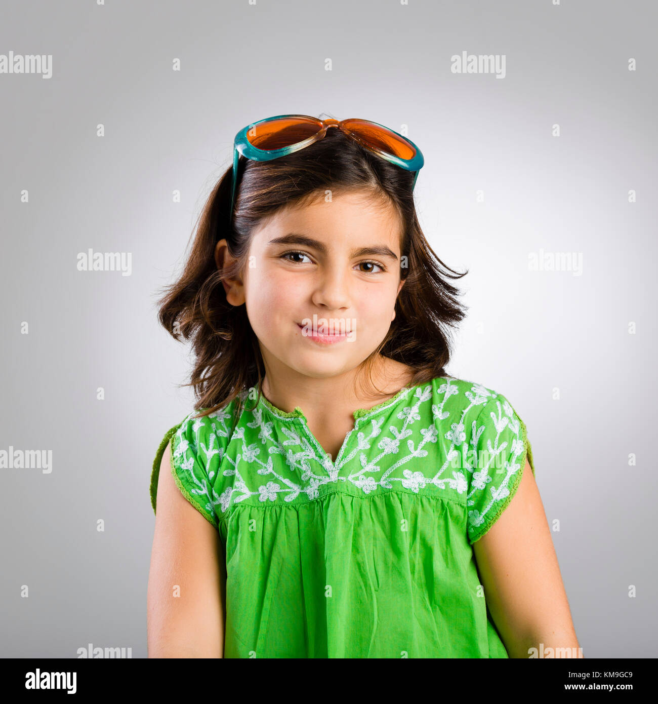 Portrait of a happy young girl wearing funny sunglasses Stock Photo Alamy