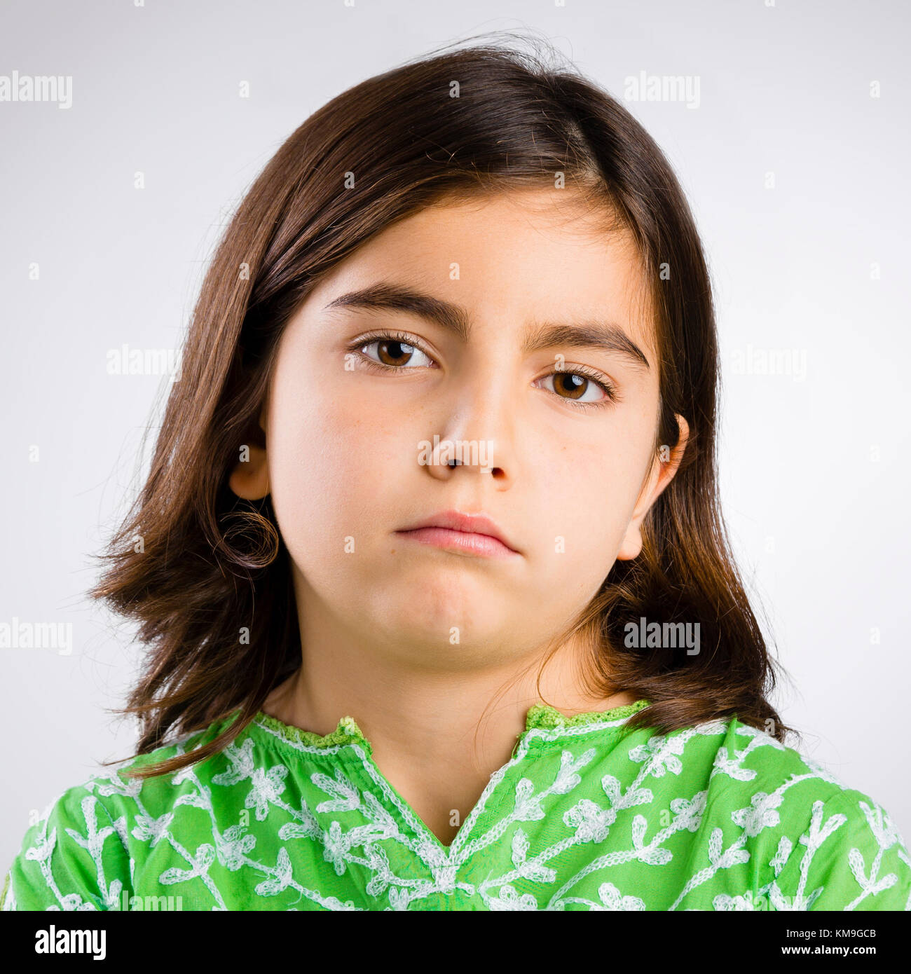 Portrait of a little girl making a serious expression Stock Photo