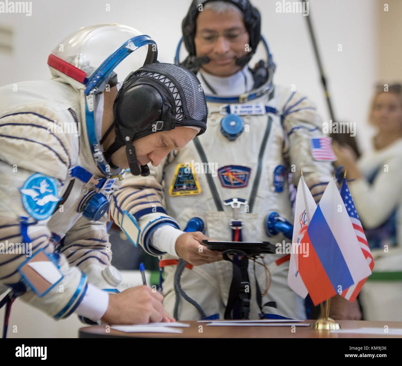NASA International Space Station (ISS) Expedition 53 prime crew members Russian cosmonaut Alexander Misurkin of Roscosmos (left) and American astronaut Mark Vande Hei sign documents before starting their pre-launch Soyuz qualification exams in their Sokol launch and entry spacesuits prior to the Soyuz MS-06 spacecraft launch at the Gagarin Cosmonaut Training Center August 31, 2017 in Star City, Russia.   (photo by Bill Ingalls  via Planetpix) Stock Photo