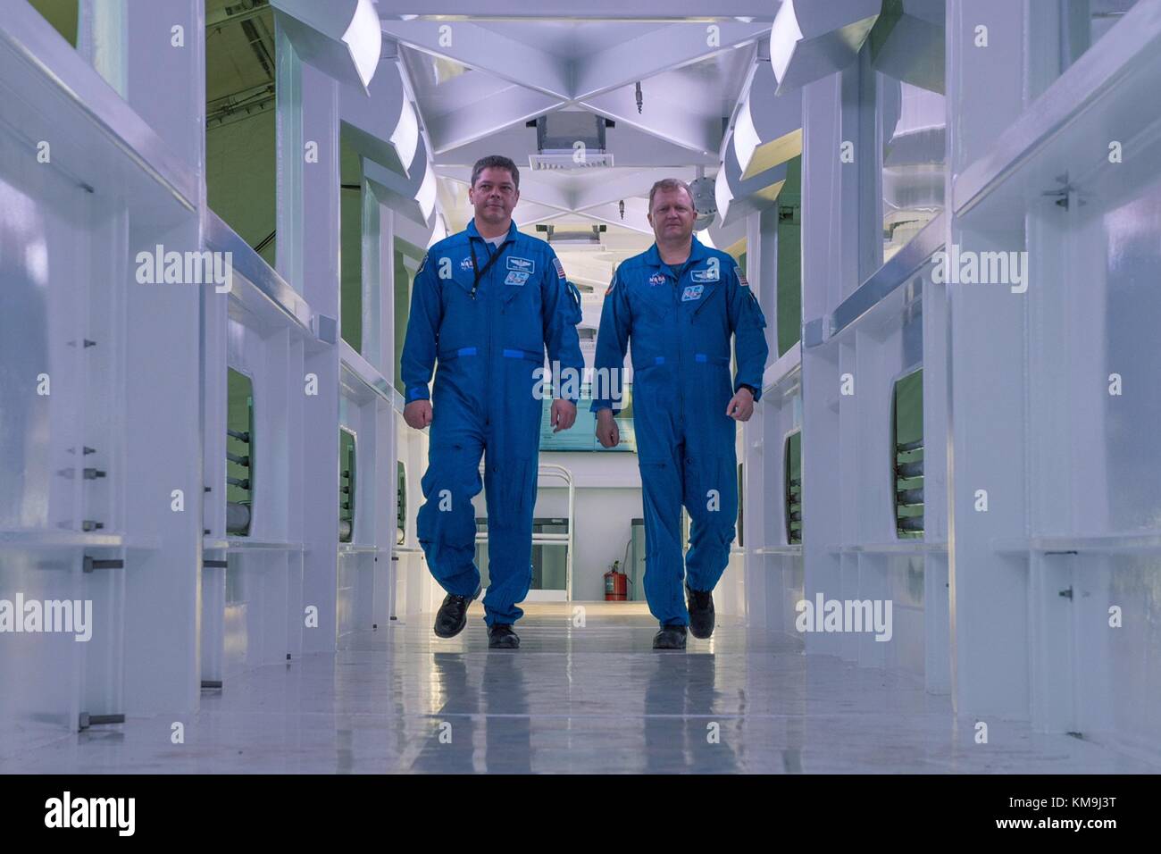 NASA astronauts Bob Behnken (left) and Eric Boe walk down the SpaceX Crew Access Arm at the Kennedy Space Center Launch Complex 39A August 30, 2017 in Merritt Island, Florida.  (photo by NASA Photo  via Planetpix) Stock Photo