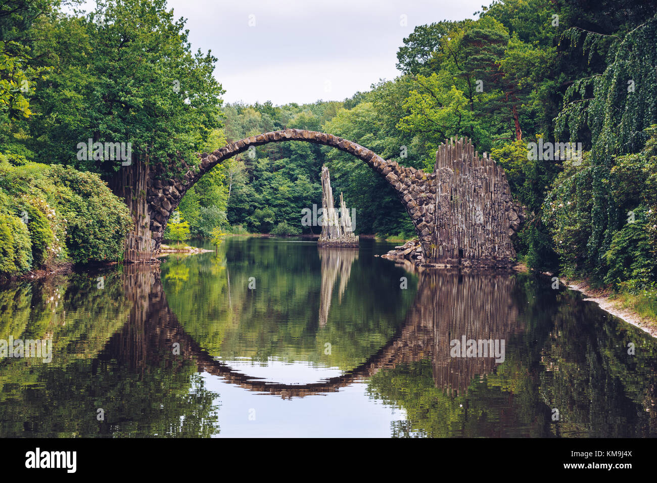 Rakotz bridge (Rakotzbrucke) also known as Devil's Bridge in Kromlau, Germany. Reflection of the bridge in the water create a full circle. Stock Photo