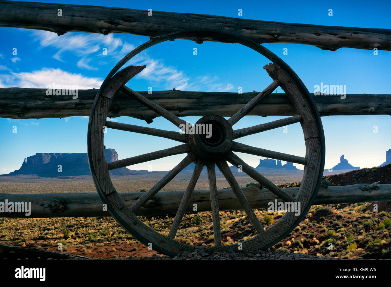 Old wagon wheel on fence at Goulding's Lodge, Monument Valley, Colorado, USA Stock Photo