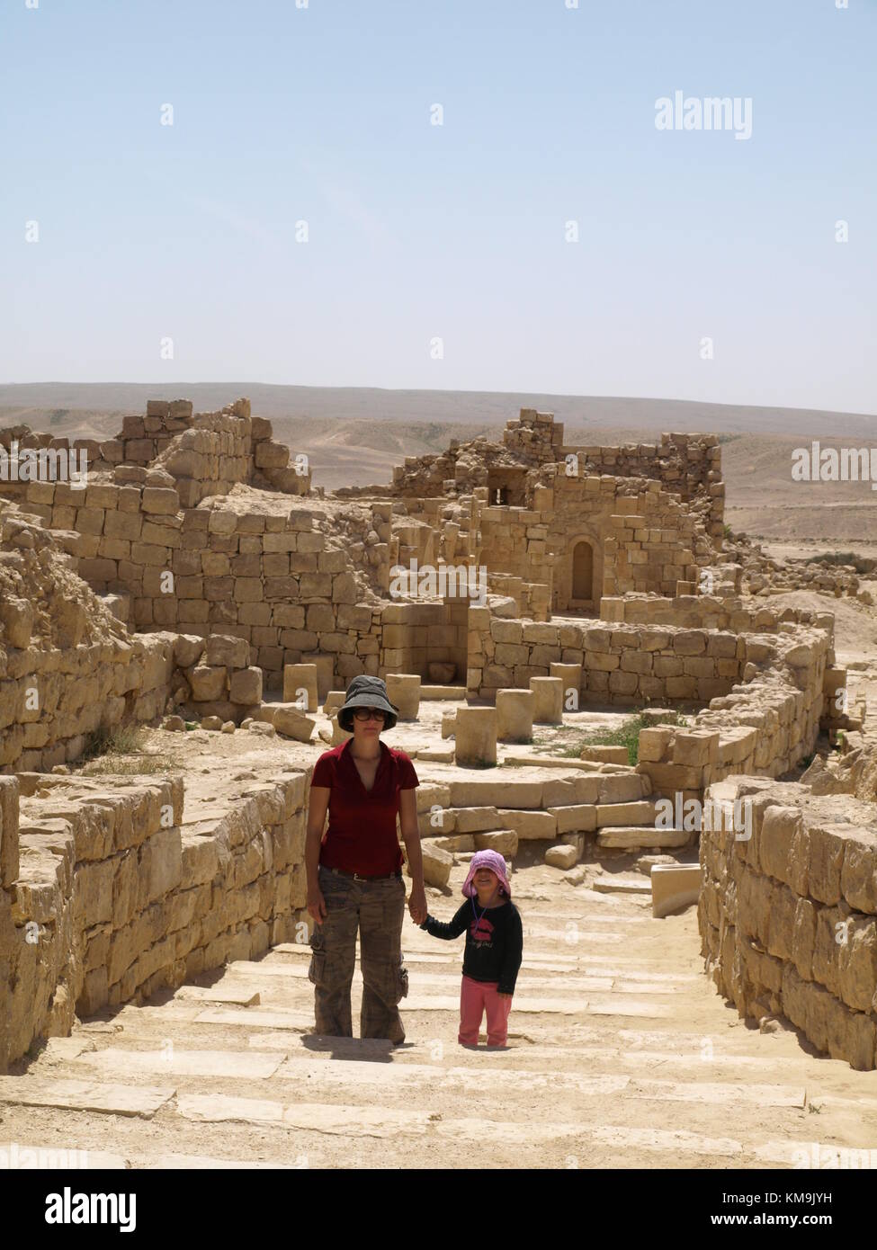 mother and daughter visiting Ancient city remains and walking on an old road or stairway Stock Photo