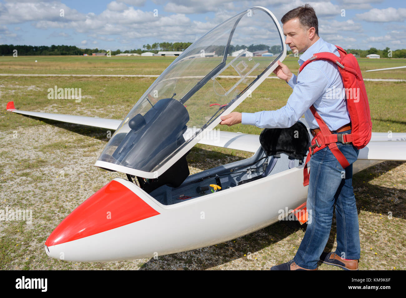 man ready to fly an ultralight propellerdriven airplane Stock Photo