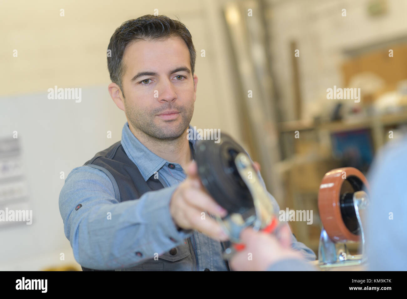 man working with wheels Stock Photo Alamy