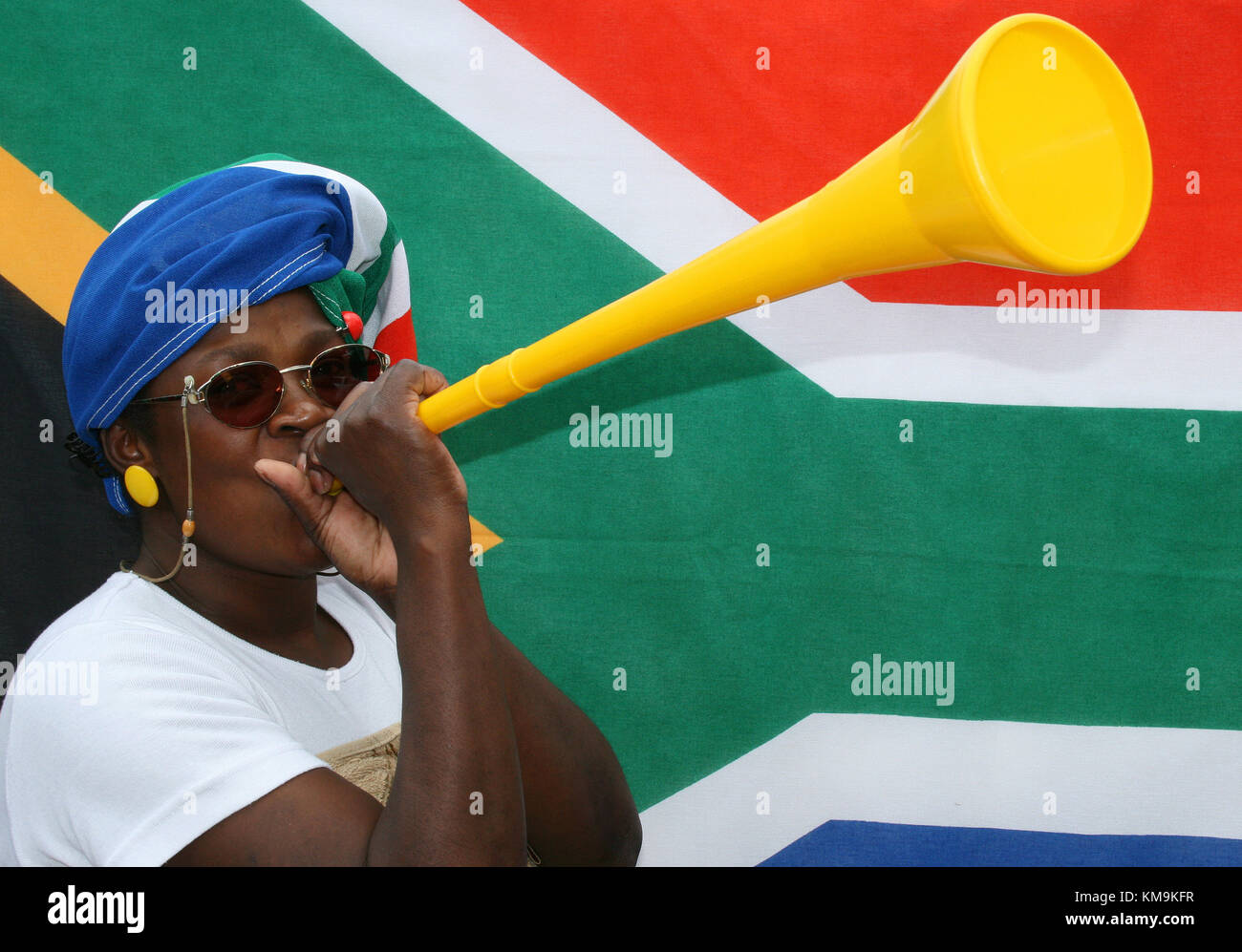 African woman blowing a vuvuzela , Pretoria, South Africa Stock Photo