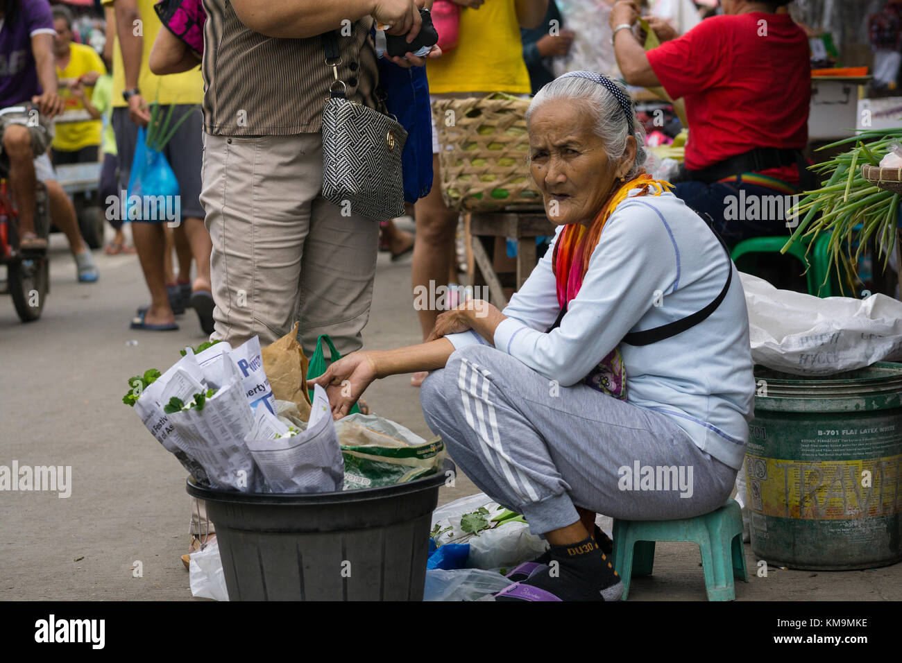 Elderly Filipino women selling herbs within the Carbon Market,Cebu City,Philippines Stock Photo