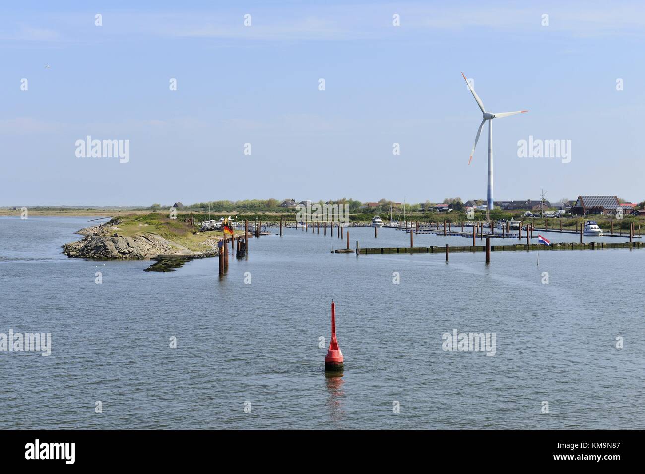 Borkum's almost empty marina Port Henry with a windmill on the island in the background, 7 May 2017 | usage worldwide Stock Photo