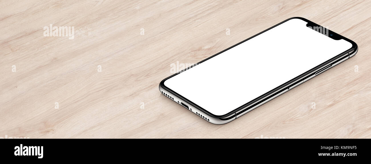 Isometric smartphone similar to iPhone X mockup lies on office desk. Banner with copy space. Stock Photo