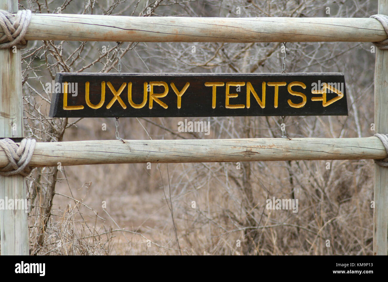 Kruger National Park, Marloth Park, wooden signboard showing luxury tents Stock Photo
