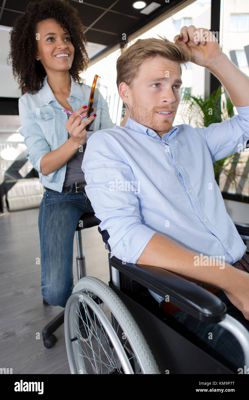 Male hairdresser in wheelchair hi-res stock photography and images - Alamy