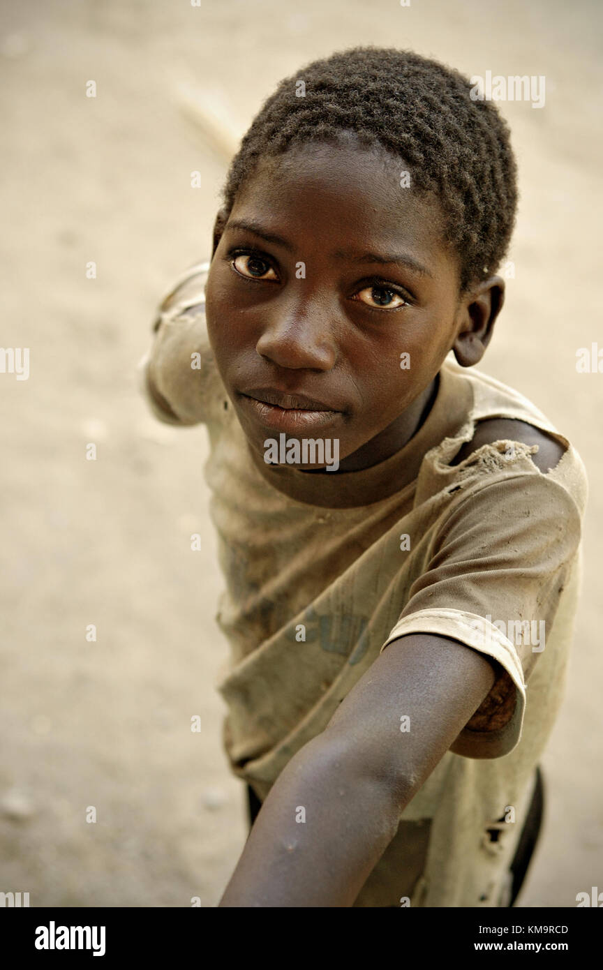 Boy wearing a ripped t-shirt in Kawaza village, Eastern Province, Zambia Stock Photo