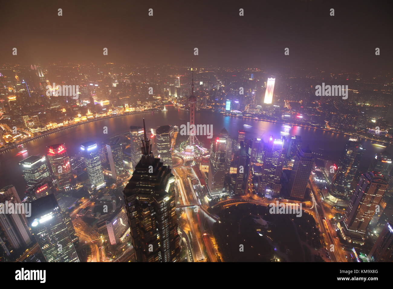 Shanghai is the biggest city from China, in this picture i captured the Bund, Huangpu River, Oriental Pearl Tower and the beautiful city lights Stock Photo