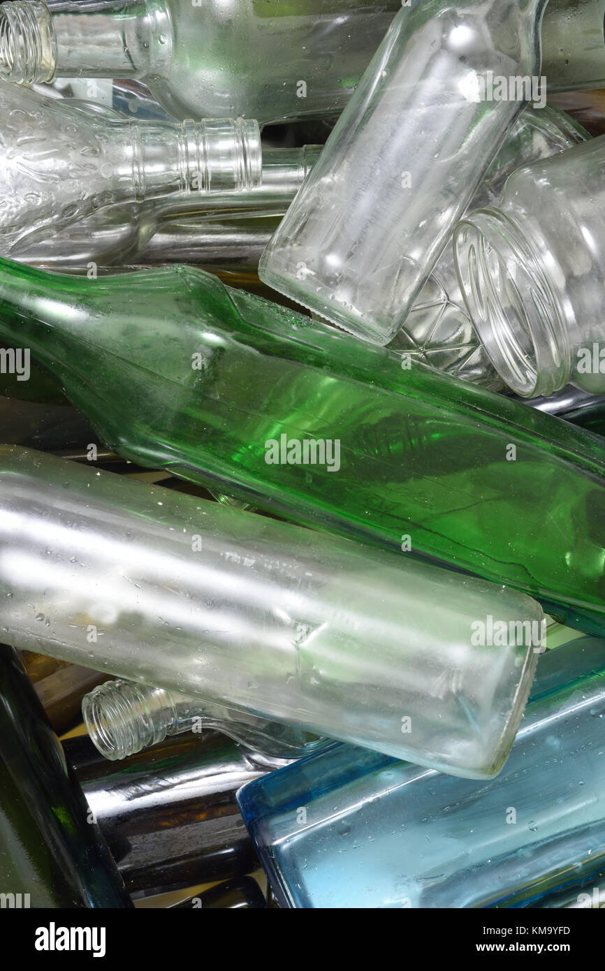 Glass bottles inside a glass recycling container Stock Photo Alamy