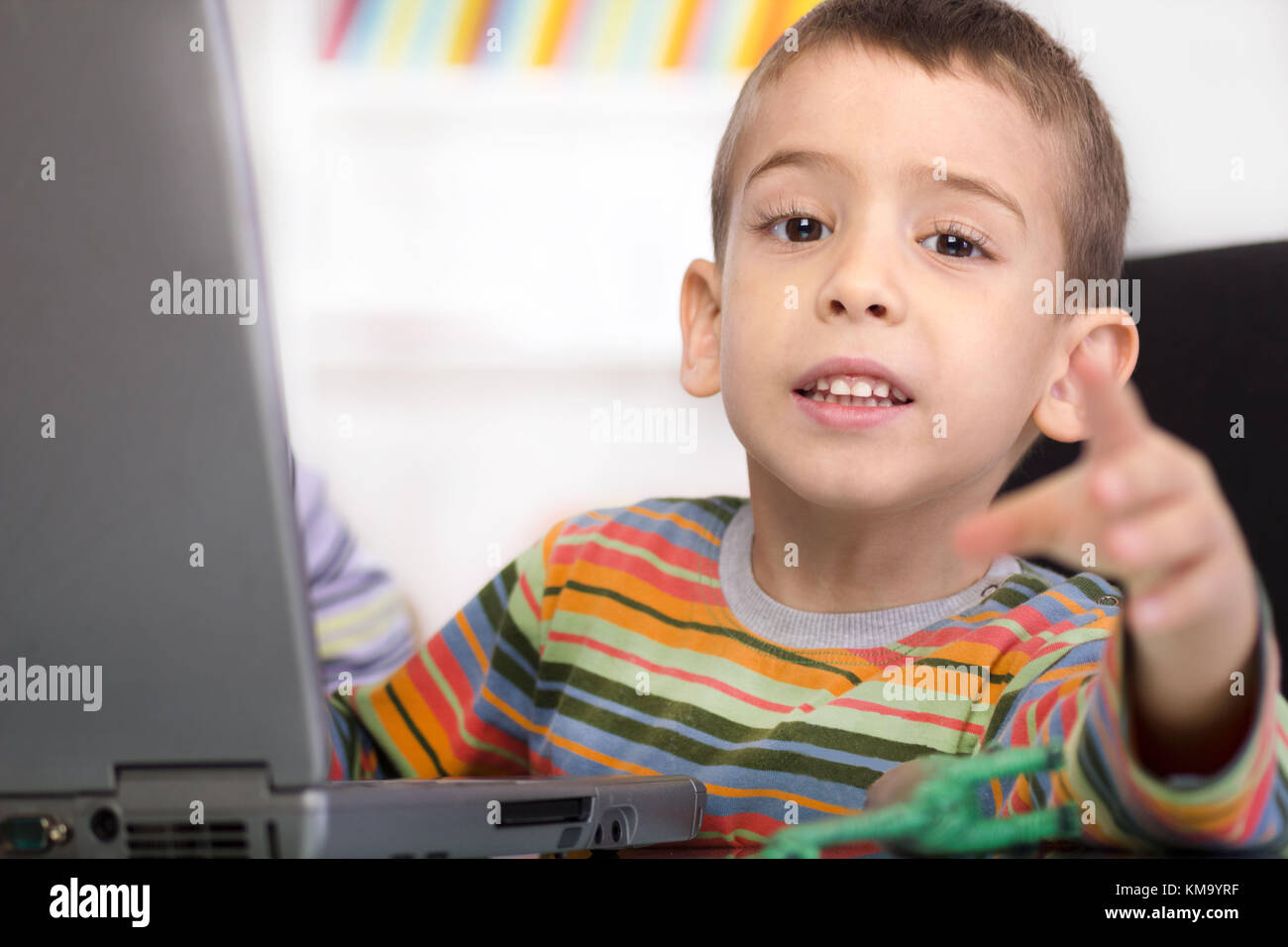 cute little boy with laptop shows Stock Photo - Alamy