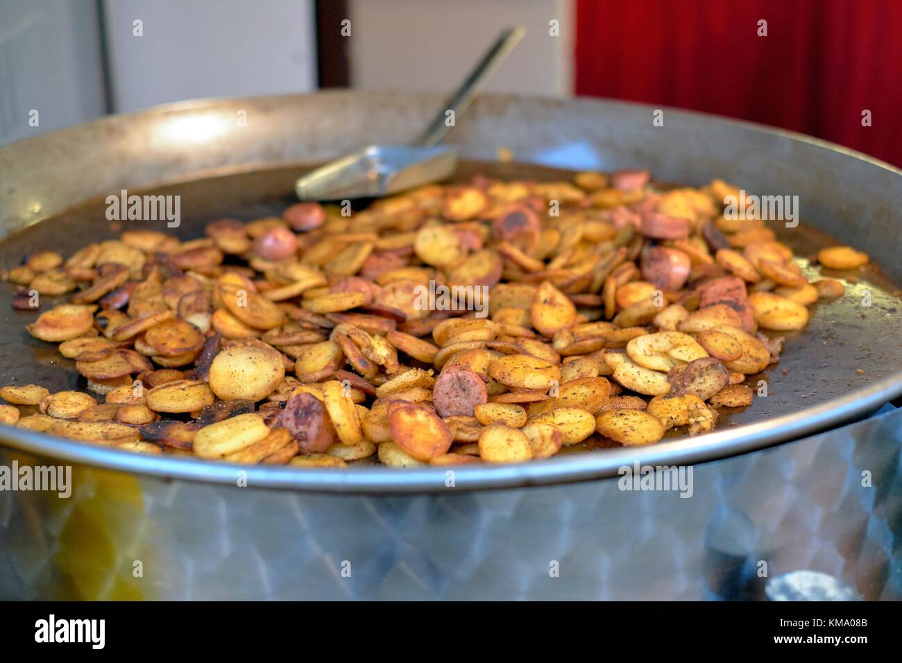 Potato slices in a large pan, Nottingham Christmas market 2017 Stock Photo