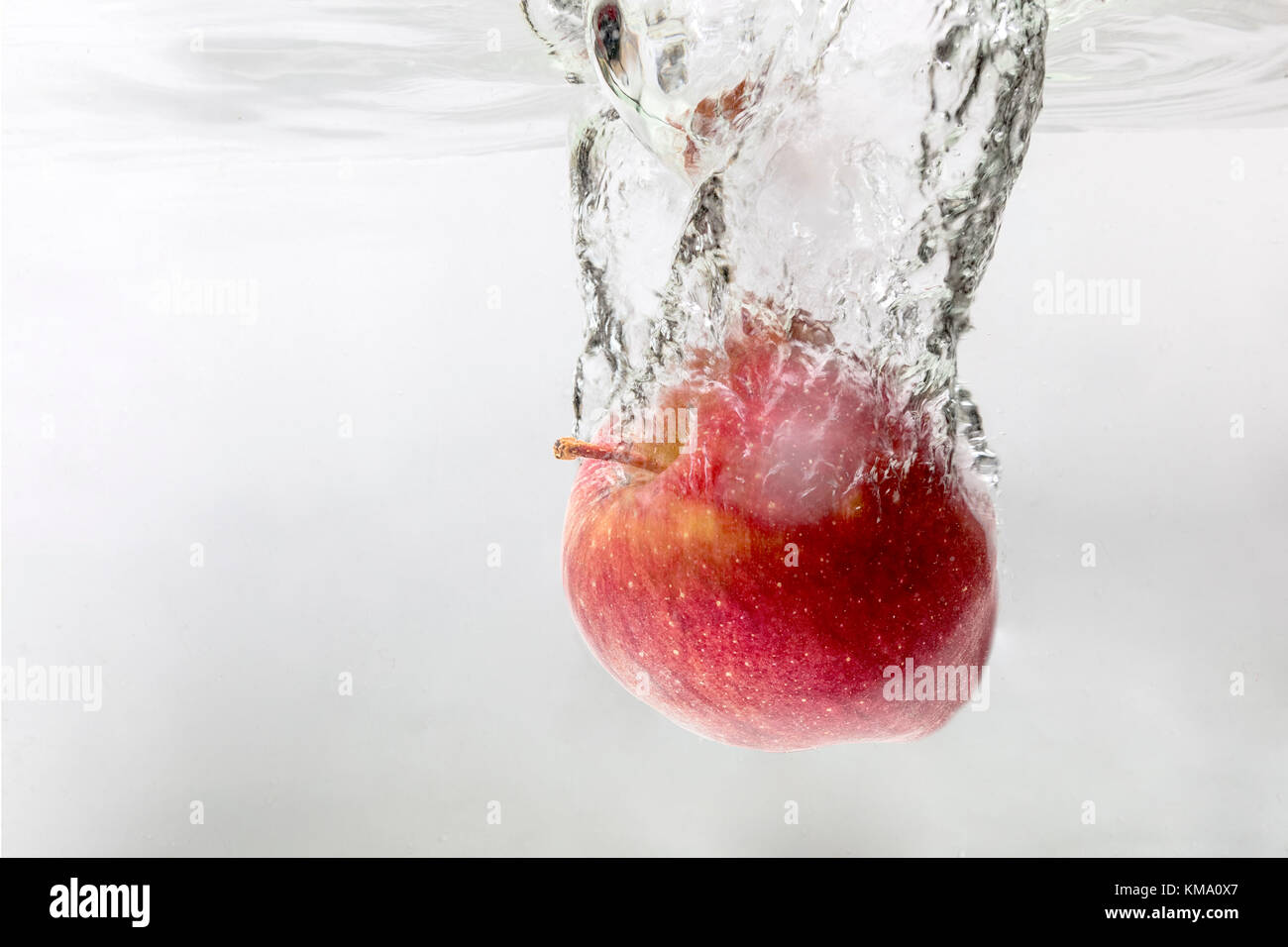 Apple splash water Stock Photo Alamy