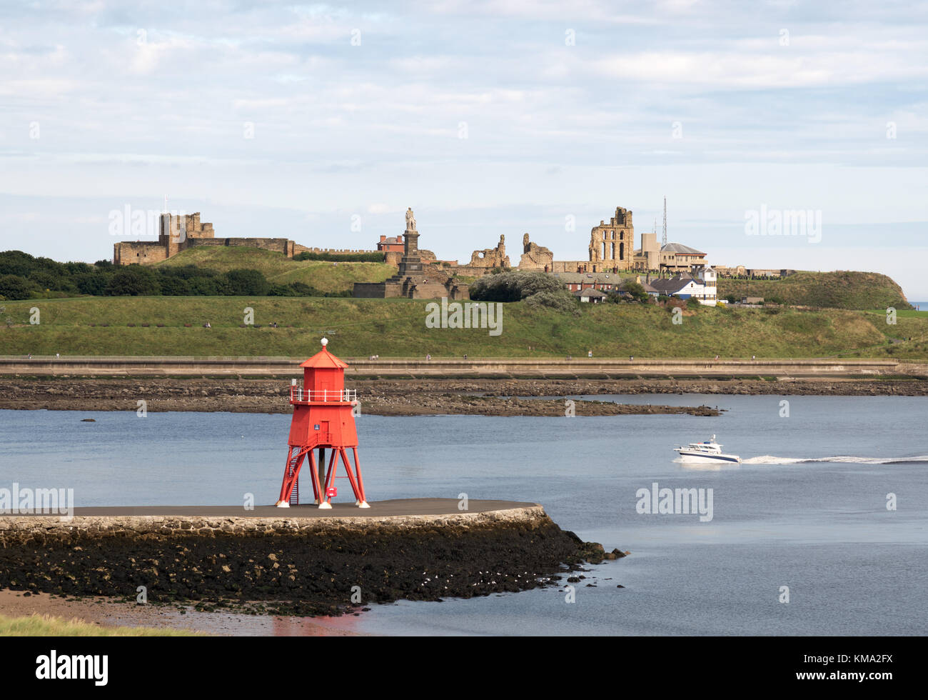 The Herd Groyne lighthouse South Shields looking across the Tyne estuary to Tynemouth, north east England, UK Stock Photo
