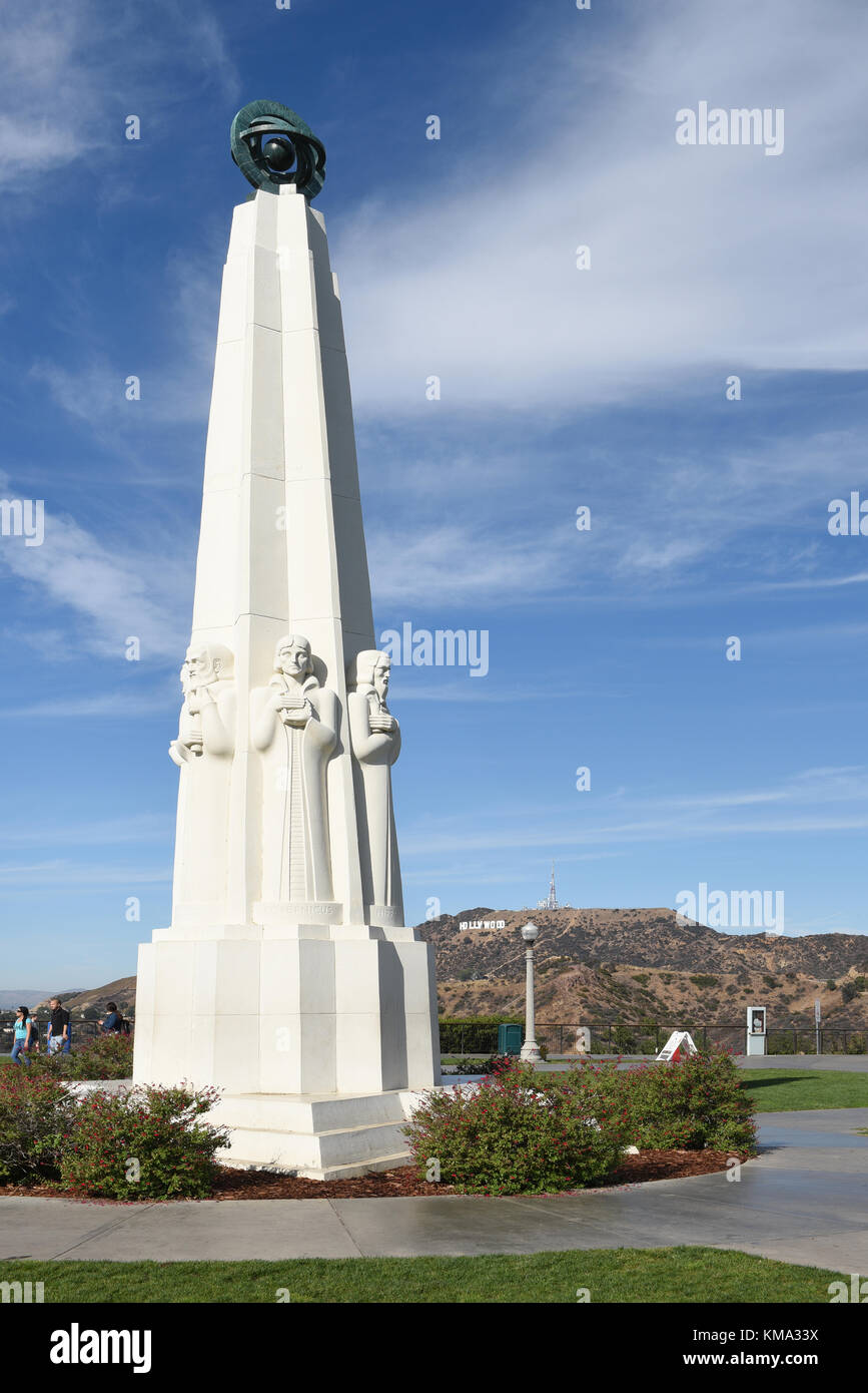 LOS ANGELES - NOVEMBER 24, 2017: Astronomers Monument at the Griffith Observatory, with the Hollywood sign in the background. Stock Photo