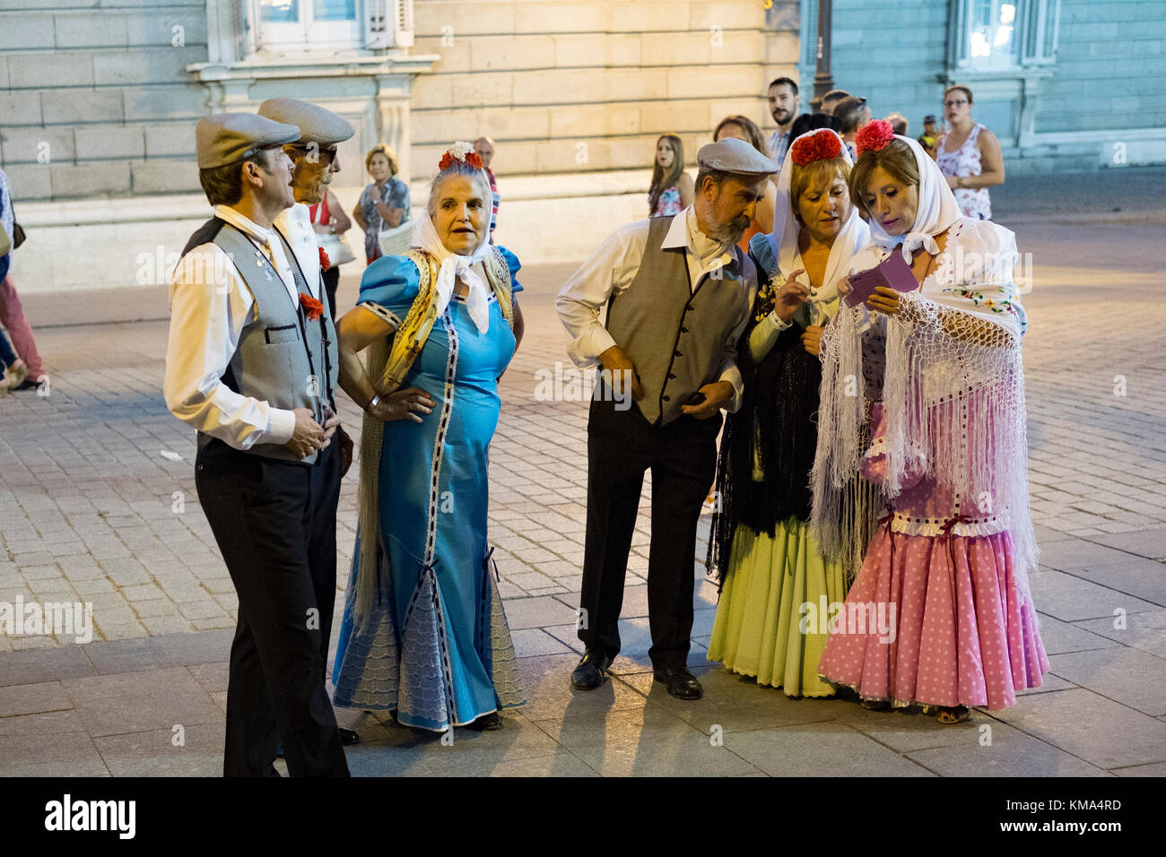 Artists and volunteers perform in front of Royal Palace Madrid Stock Photo